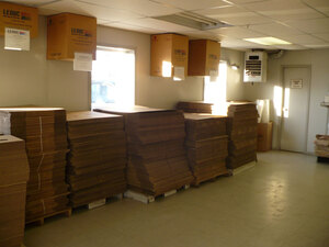 Stacks of flattened corrugated boxes available at Leduc Bottle Depot for moving, for storage, for anything!